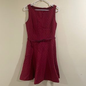 The limited Maroon crack tail dress size 4 with belt